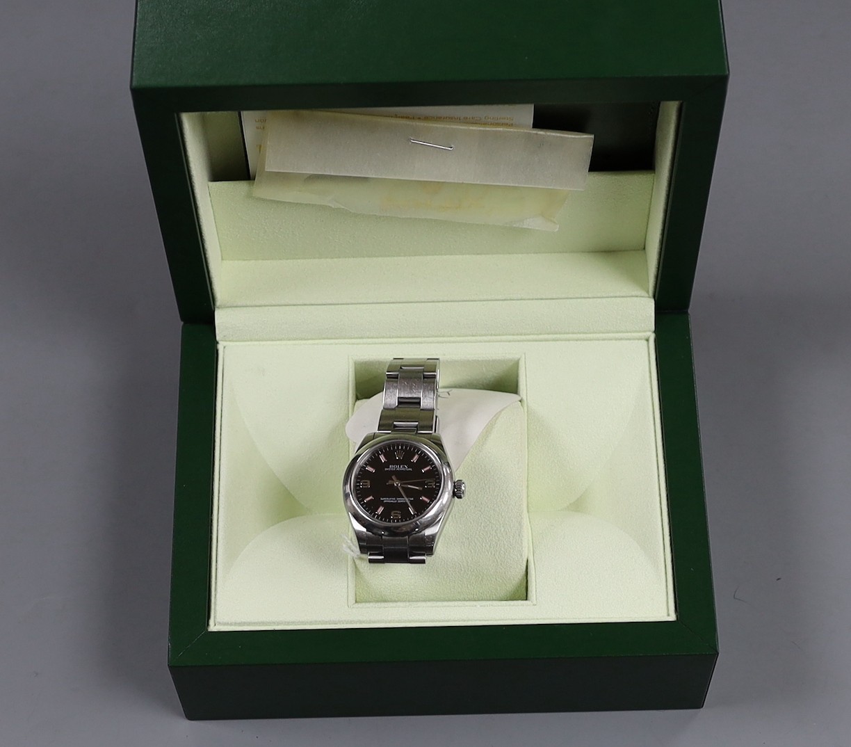 A lady's 2011 stainless steel Rolex Oyster Perpetual wrist watch, on a stainless steel Rolex bracelet, case diameter 31mm, with box and certificate, model no. 177200, serial no. V958067.